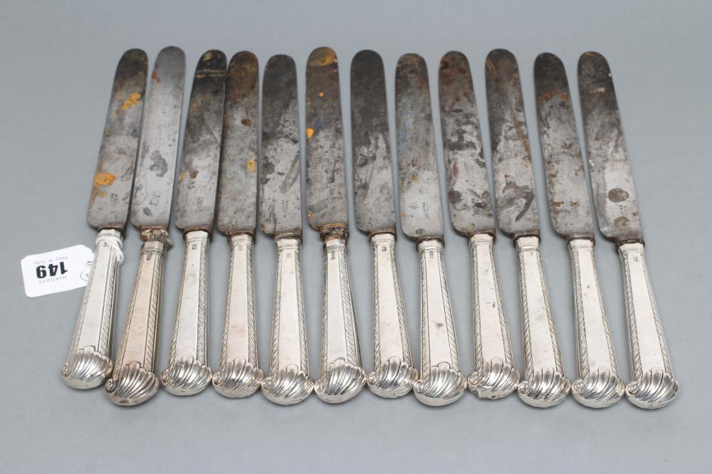 A COMPOSITE SET OF TWELVE GEORGE III SILVER PISTOL GRIP HANDLED TABLE KNIVES Image