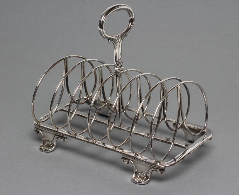 A WILLIAM IV SILVER SEVEN BAR WIREWORK TOASTRACK Image