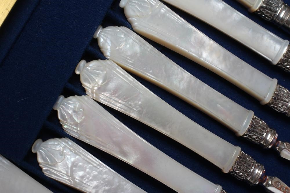 A SET OF SIX PAIRS OF VICTORIAN SILVER DESSERT KNIVES AND FORKS Image