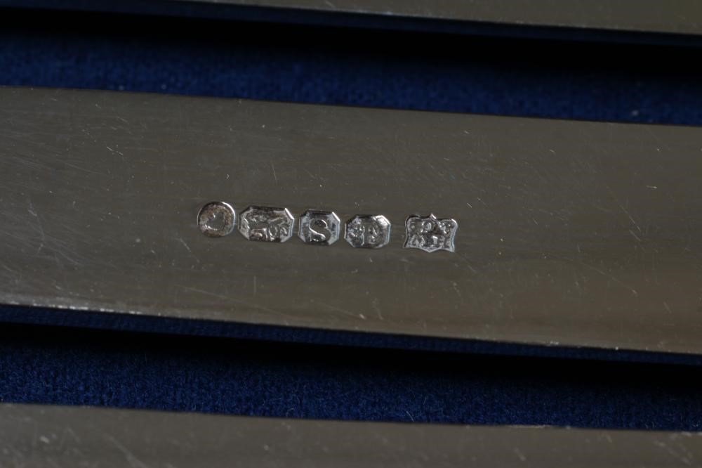 A SET OF SIX PAIRS OF VICTORIAN SILVER DESSERT KNIVES AND FORKS Image