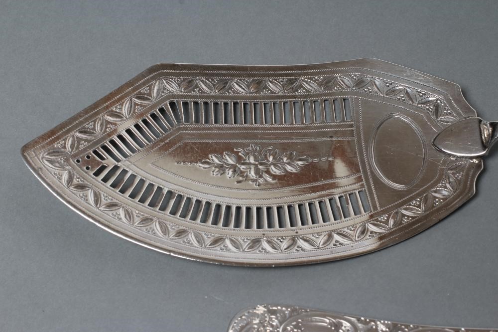 A PAIR OF LATE VICTORIAN SILVER SERVING SPOONS Image