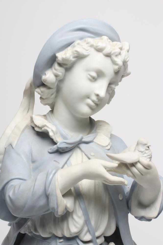A VICTORIAN PARIAN FIGURE OF A VINTAGER holding a dove and standing beside a grape hod Image
