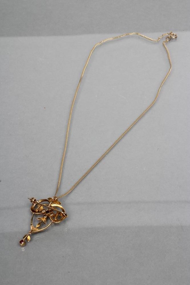 AN EDWARDIAN OPEN PENDANT/BROOCH set with seed pearls and centred by a circular sapphire and four Image