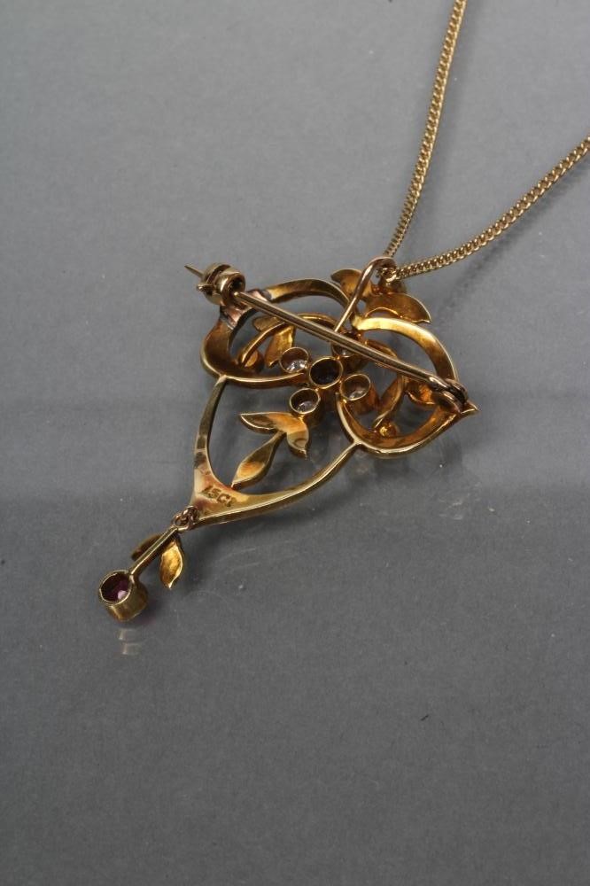 AN EDWARDIAN OPEN PENDANT/BROOCH set with seed pearls and centred by a circular sapphire and four Image