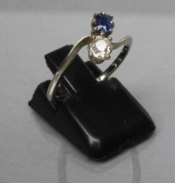 A SAPPHIRE AND DIAMOND CROSSOVER RING Image