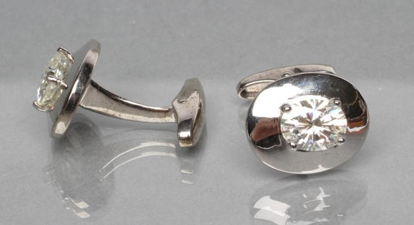 A PAIR OF OVAL SILVER CUFFLINKS each set with an oval cut moissanite Image