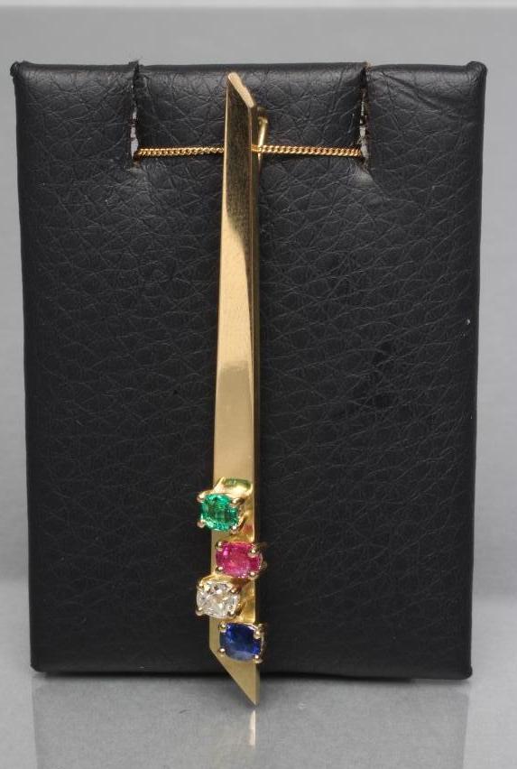 A MODERNIST STYLE ANGULAR PENDANT set with a calibre cut emerald Image