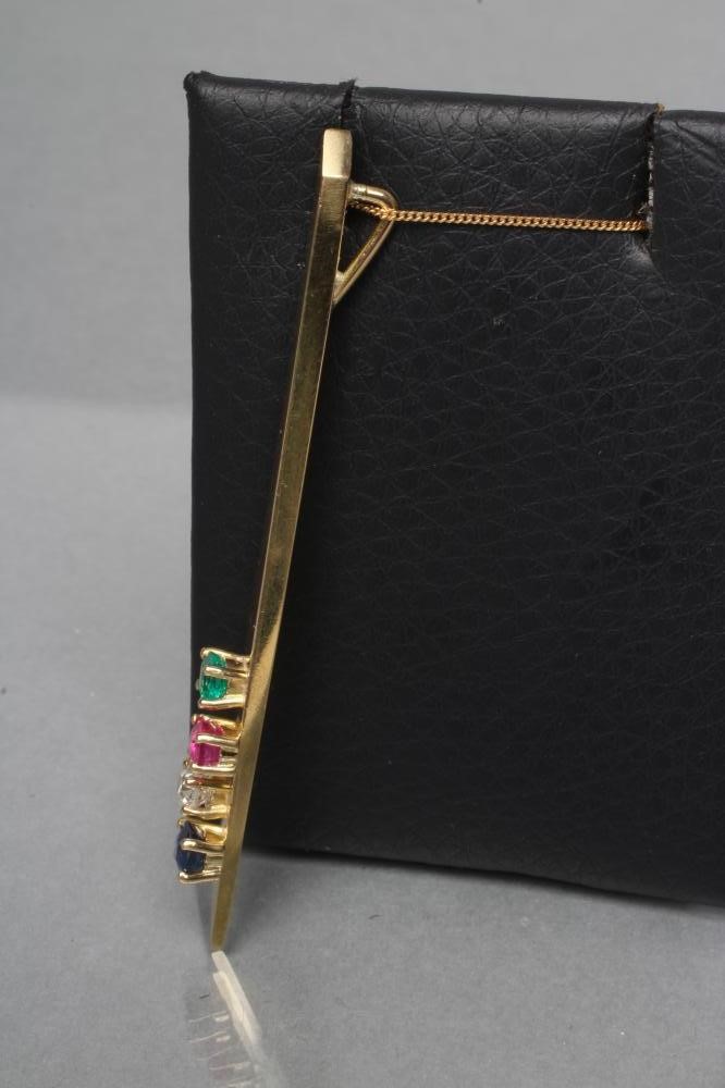 A MODERNIST STYLE ANGULAR PENDANT set with a calibre cut emerald Image