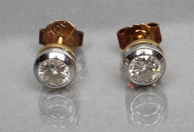 A PAIR OF DIAMOND SOLITAIRE STUD EARRINGS Image