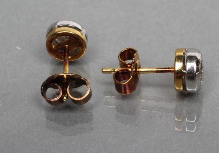 A PAIR OF DIAMOND SOLITAIRE STUD EARRINGS Image