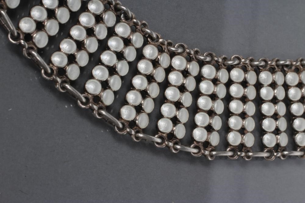 A NORWEGIAN SILVER AND WHITE ENAMEL COLLAR made up of fifty two pairs of ten white enamelled Image