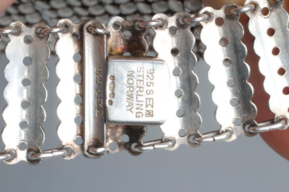 A NORWEGIAN SILVER AND WHITE ENAMEL COLLAR made up of fifty two pairs of ten white enamelled Image