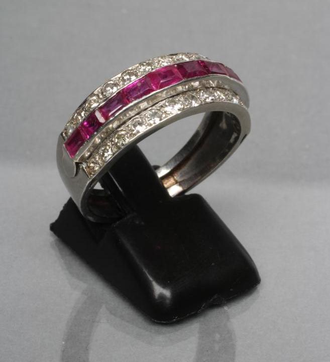A RUBY AND DIAMOND HALF HOOP RING Image