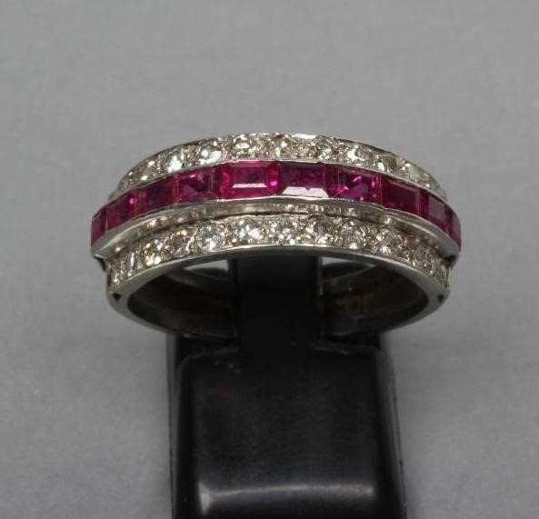 A RUBY AND DIAMOND HALF HOOP RING Image