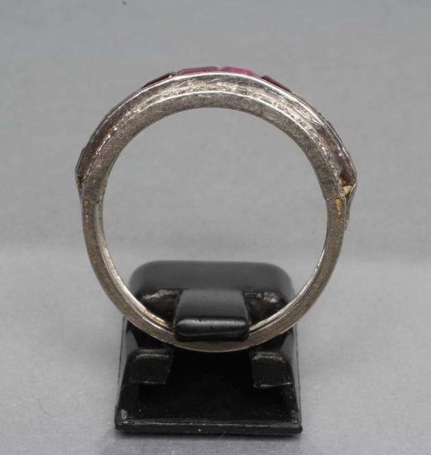 A RUBY AND DIAMOND HALF HOOP RING Image