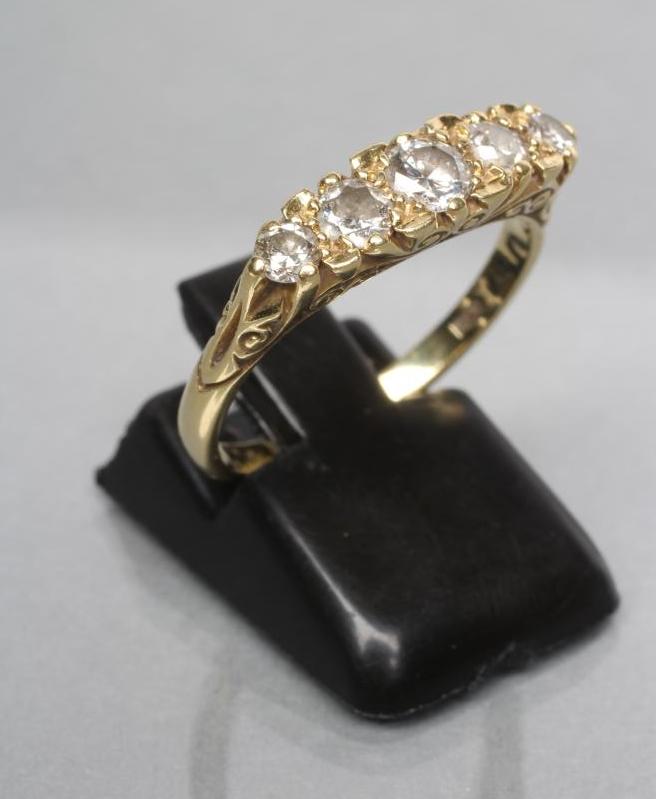 A FIVE STONE DIAMOND RING Image