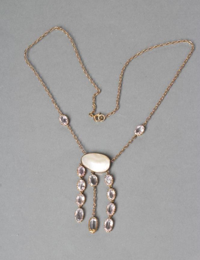AN EDWARDIAN NECKLACE centred by a collet set mother of pearl panel pendant with three chains set Image