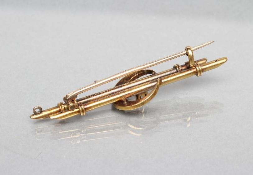 A LATE VICTORIAN DOUBLE BAR BROOCH centred by a small claw set diamond within a seed pearl crescent Image