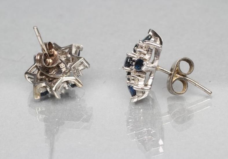 A PAIR OF SAPPHIRE AND DIAMOND STAR CLUSTER EAR STUDS Image