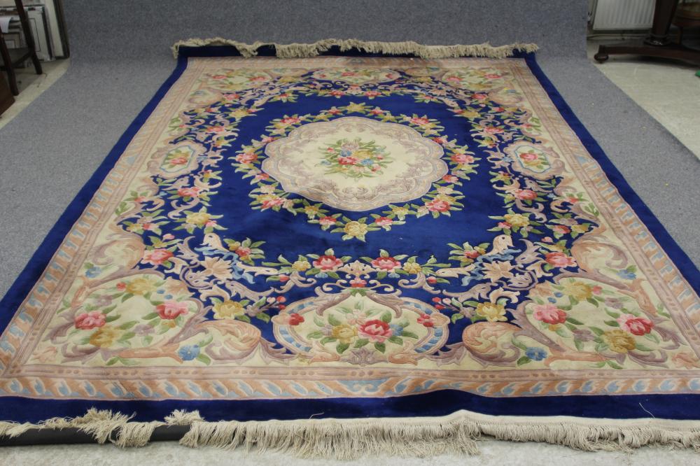 A CHINESE WASHED AND FRINGED CARPET Image