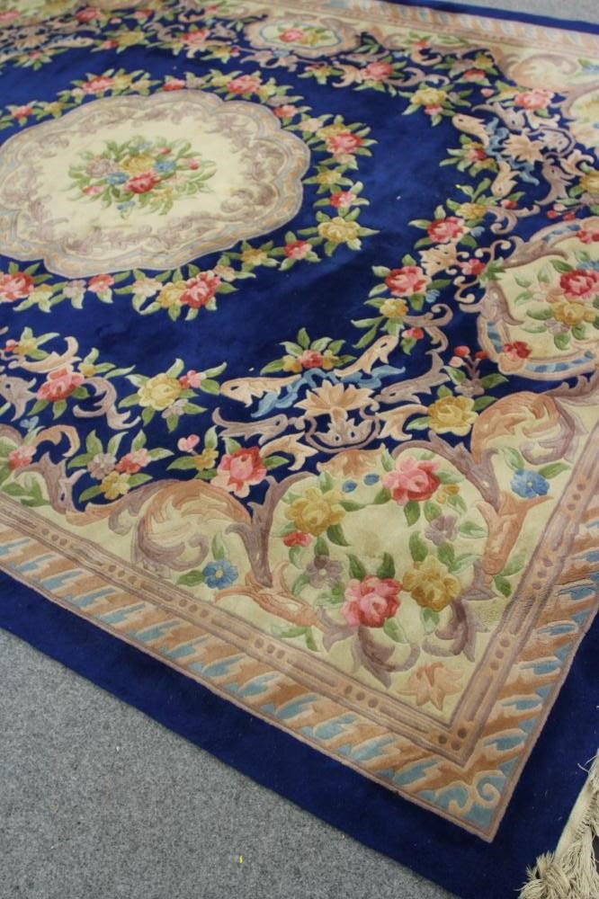 A CHINESE WASHED AND FRINGED CARPET Image