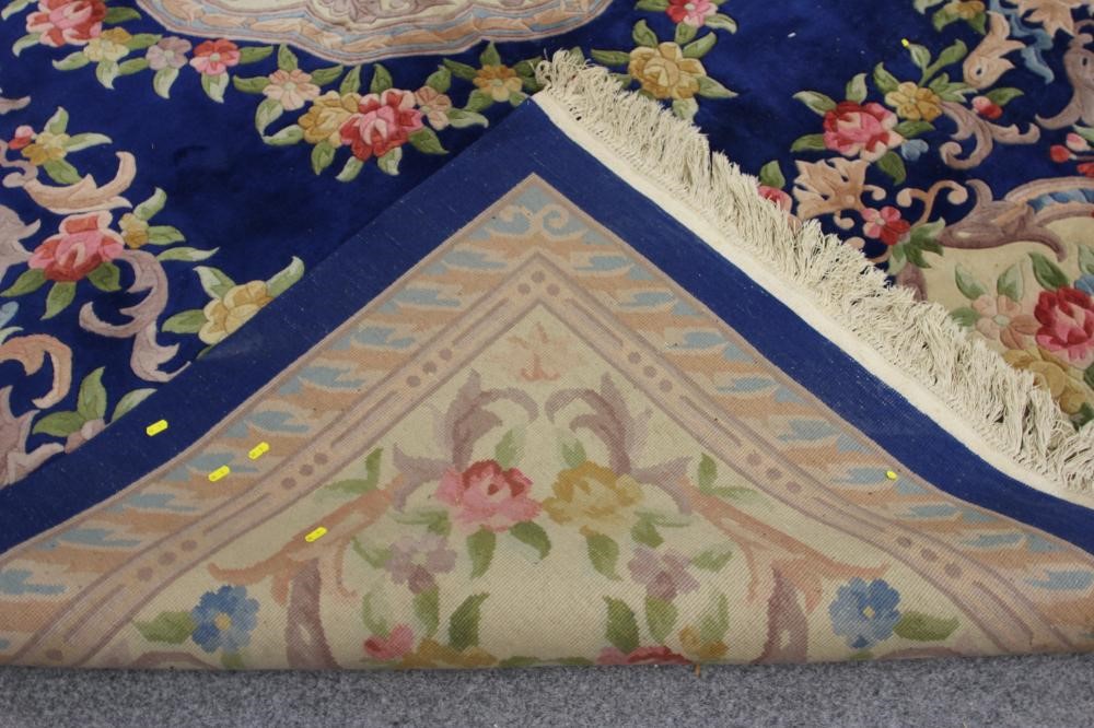 A CHINESE WASHED AND FRINGED CARPET Image