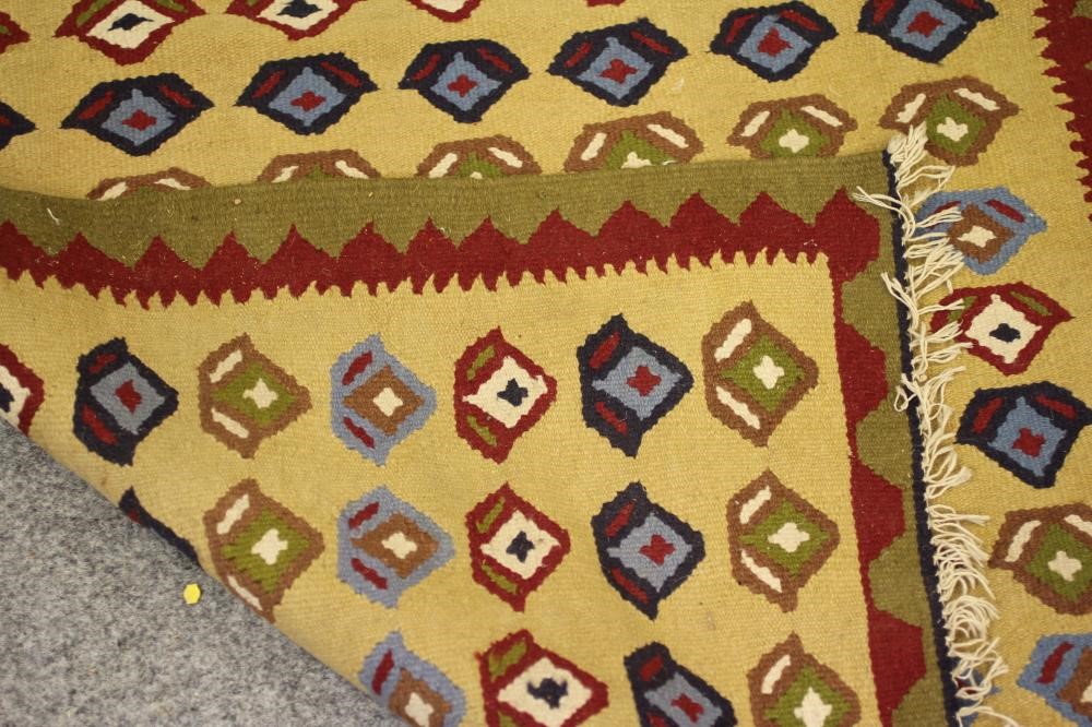 A SMALL PERSIAN TRIBAL RUG Image