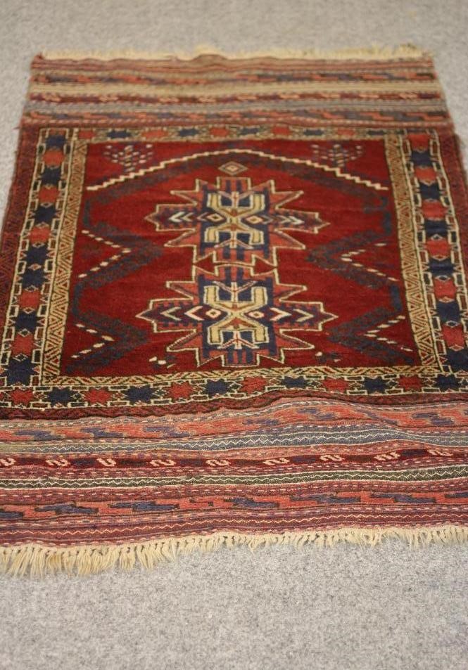 A SMALL PERSIAN TRIBAL RUG Image