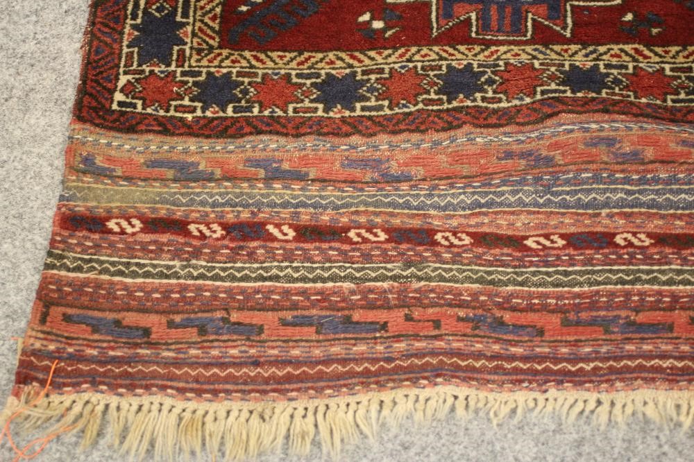 A SMALL PERSIAN TRIBAL RUG Image