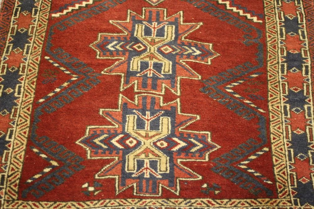 A SMALL PERSIAN TRIBAL RUG Image