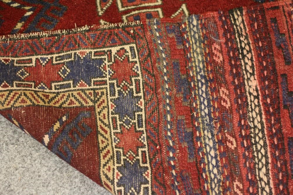 A SMALL PERSIAN TRIBAL RUG Image