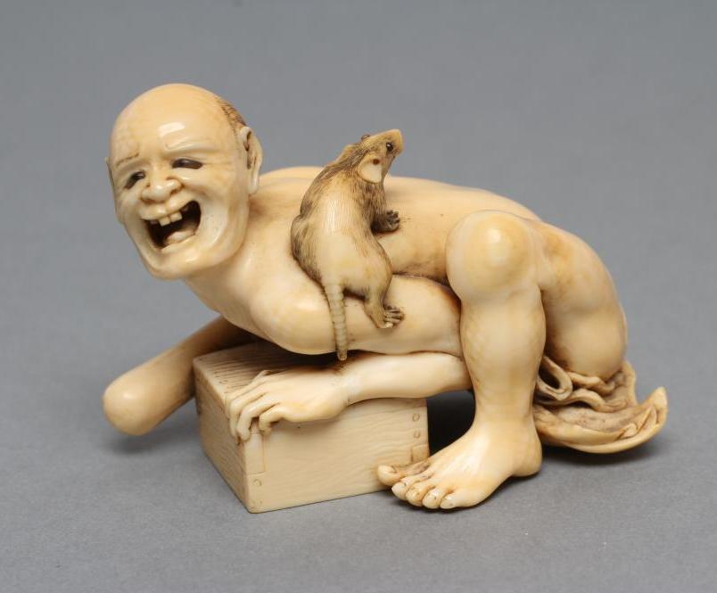 A JAPANESE IVORY SMALL OKIMONO NETSUKE Image