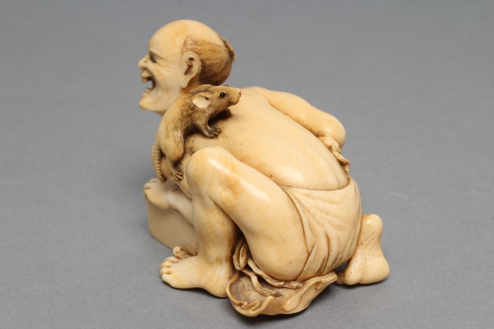 A JAPANESE IVORY SMALL OKIMONO NETSUKE Image