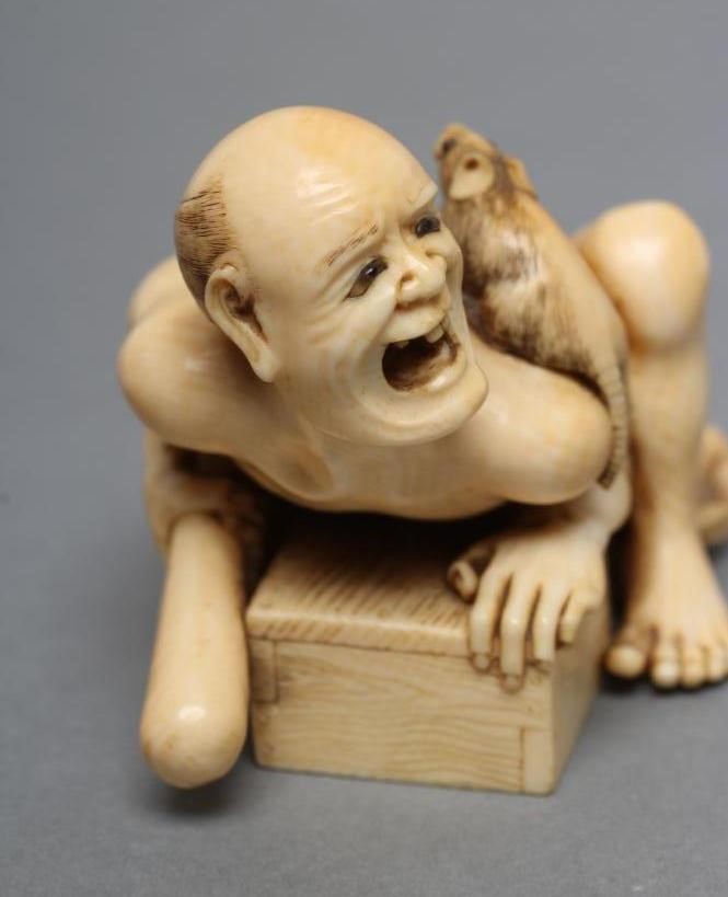 A JAPANESE IVORY SMALL OKIMONO NETSUKE Image