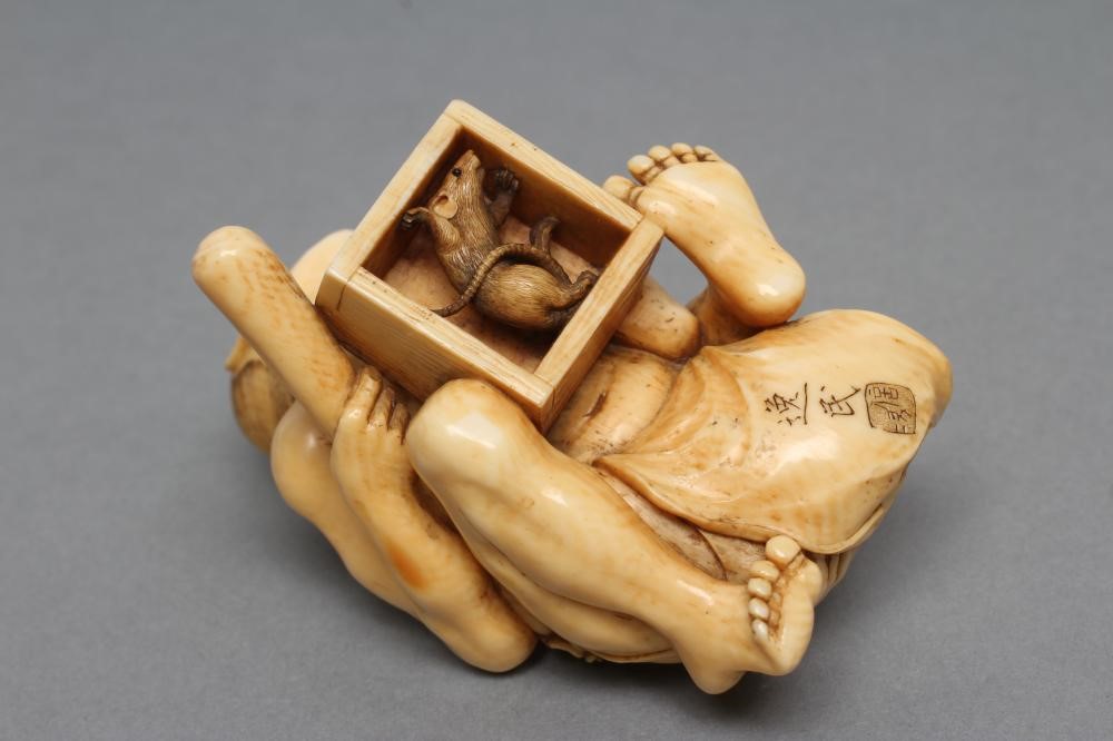 A JAPANESE IVORY SMALL OKIMONO NETSUKE Image