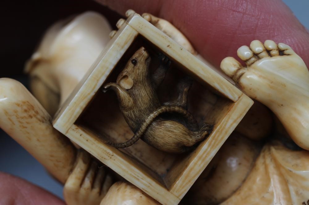 A JAPANESE IVORY SMALL OKIMONO NETSUKE Image