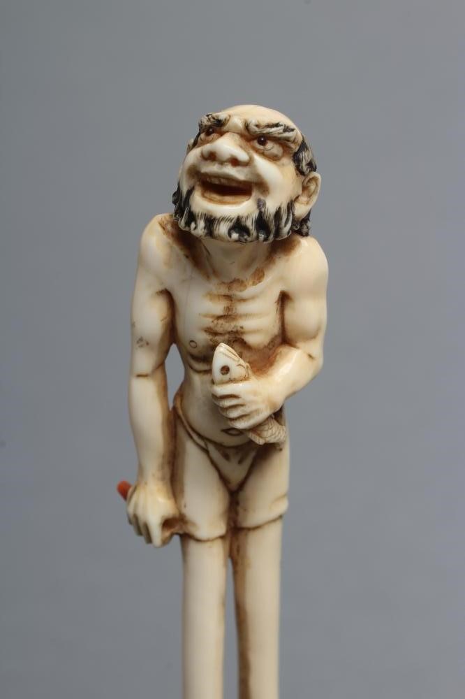 A JAPANESE IVORY OKIMONO NETSUKE Image