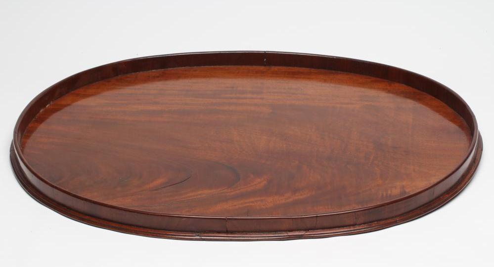 A LARGE GEORGIAN MAHOGANY TRAY of oval form with plain solid gallery Image