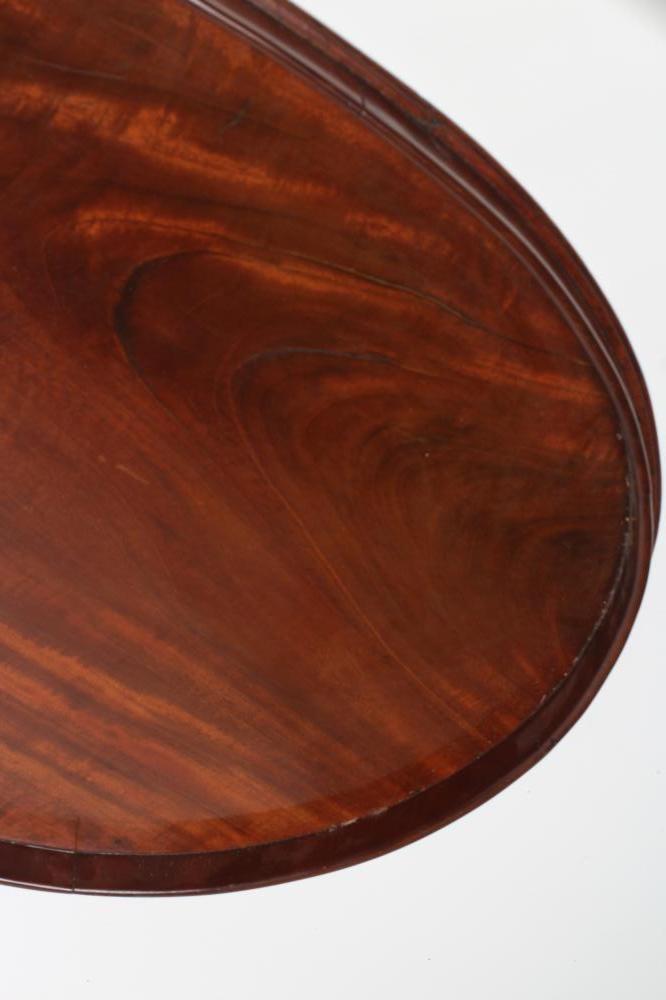 A LARGE GEORGIAN MAHOGANY TRAY of oval form with plain solid gallery Image