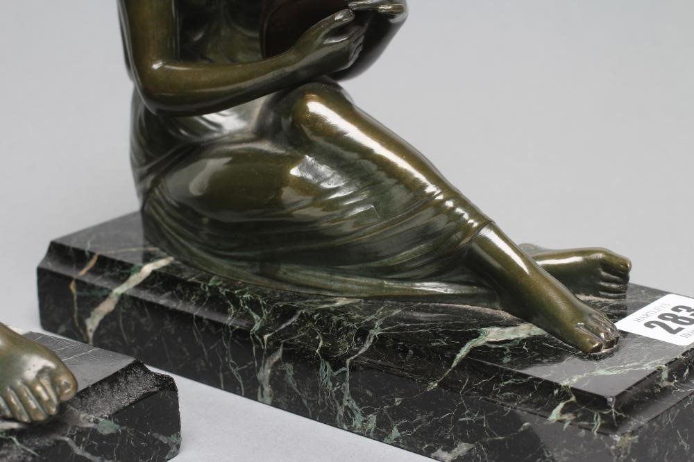 BY AND AFTER PIERRE LE FAGUAYS (1892-1962) - a pair of art deco bronze figural bookends cast as a Image