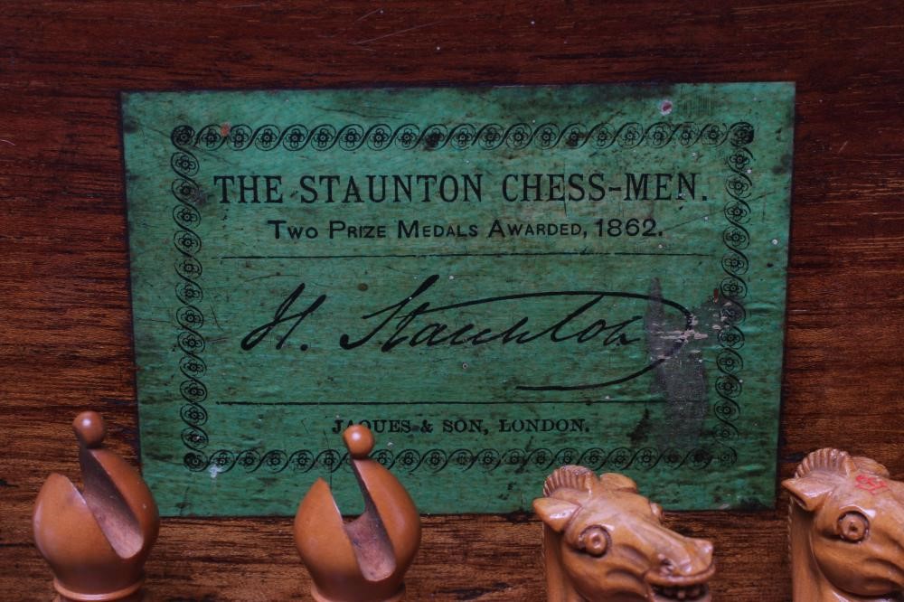 A VICTORIAN JAQUES BOXWOOD AND EBONY STAUNTON CHESS SET Image
