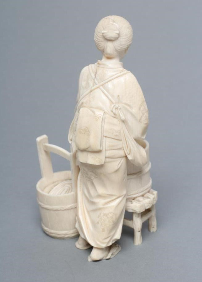 A JAPANESE IVORY FIGURE Image