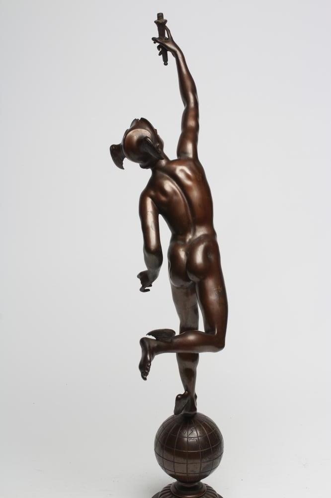 A BRONZE FIGURAL TABLE LAMP modelled as Mercury holding aloft a torch Image