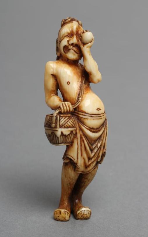 A JAPANESE IVORY NETSUKE Image