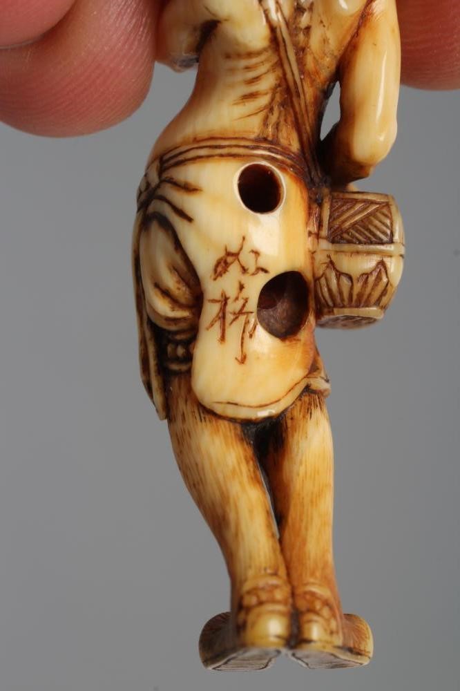 A JAPANESE IVORY NETSUKE Image