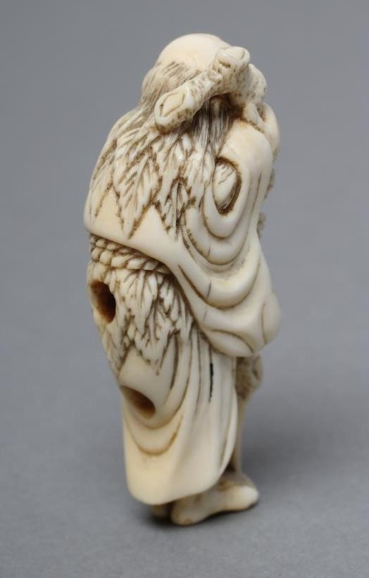 A JAPANESE IVORY NETSUKE Image