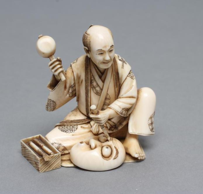 A JAPANESE IVORY OKIMONO Image