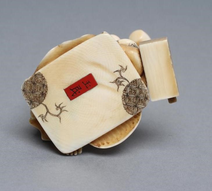 A JAPANESE IVORY OKIMONO Image