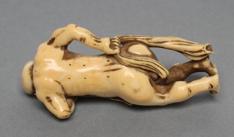 A JAPANESE IVORY NETSUKE Image