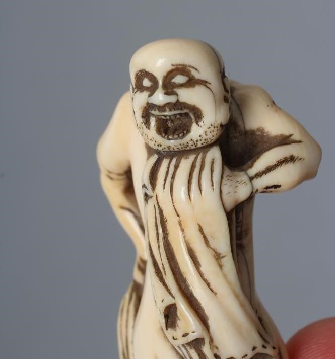 A JAPANESE IVORY NETSUKE Image
